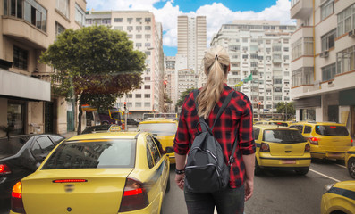 woman walks along Rio de Janeiro