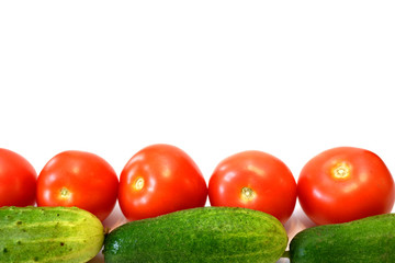 Fresh tomatoes and cucumbers on white background. Free space for your text.