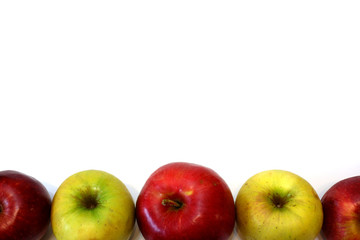 Some yellow and red apples on white background close up view. Free space for custom text.