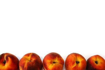 Some fresh juicy peaches on white background ckose up with empty space for custom text