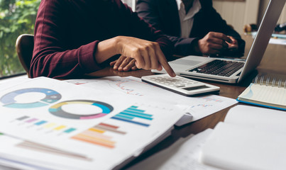 group of Asian businessmen working in a room together in an office,The media reaches the operational guidelines