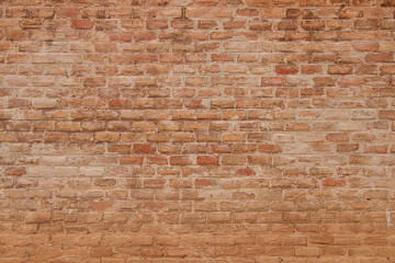 Background of stones and cobblestones. Fragment of a brick wall.