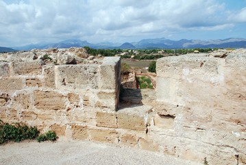 The walkway on top of the medieval stone wall in the Old Town of Alcudia on the Spanish island of Majorca.