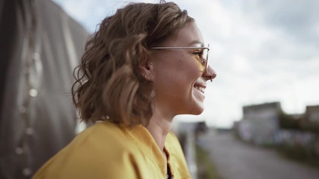 closeup of a young woman. smiling in slowmotion