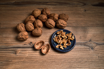 group of tasty nuts next to a bowl