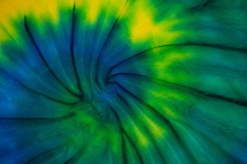 Tie Dye spiral swirl abstract texture and background , reggae style .