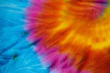 Tie Dye rainbow color , abstract texture and background , reggae style .