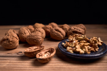 group of tasty nuts next to a bowl