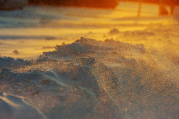 Sunset on sparkle snow at winter time.