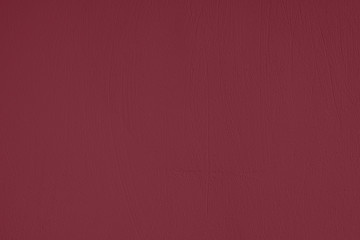 Dark red Concrete textured background to your concept or product. Winter 2020 color trend.