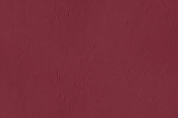 Dark red Concrete textured background to your concept or product. Winter 2020 color trend.