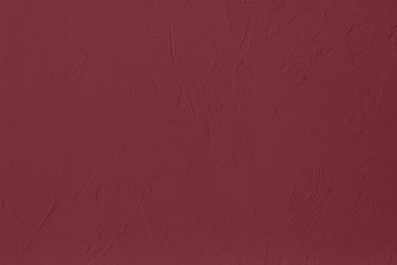 Dark red Concrete textured background to your concept or product. Winter 2020 color trend.