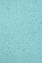 Pale blue colored low contrast Concrete textured background with roughness and irregularities to...