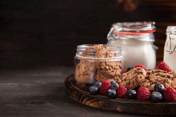 Fresh milk with delicious and freshly baked oatmel chocolate biscuits