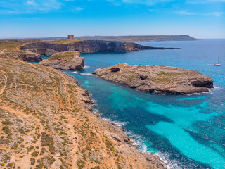 Panorama of Blue Lagoon Comino Malta. Cote Azur, turquoise clear water with white sand. Aerial view