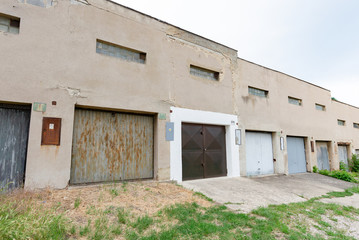 Garage street grunge old building, parking old rusty doors