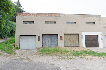 Garage street grunge old building, parking old rusty doors