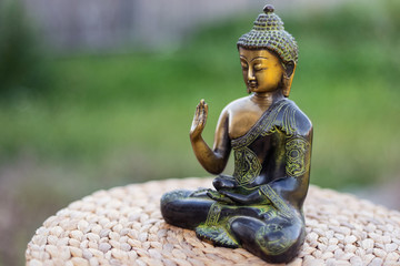 Bronze Buddha sitting statue yoga relax focus