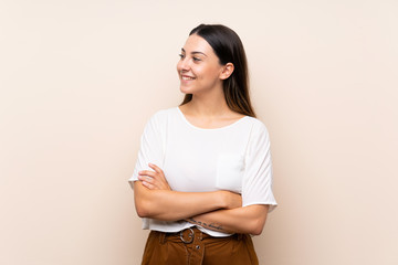 Obraz premium Young brunette woman over isolated background happy and smiling