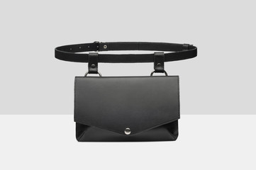 Black isolate bumbag on gray background