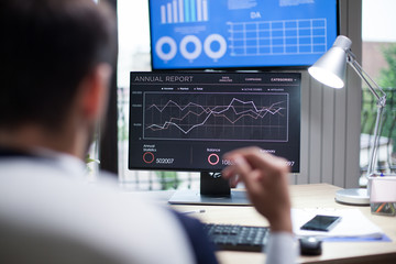 Graphics displayed on computer monitor for professional analysis by business man