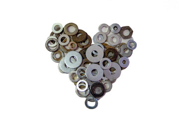 Vintage and rusty metal rings and washers in shape of heart isolated. Male diy. Concept of man craft, professional fix and repair