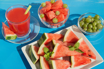 Cold watermelon juice and sliced watermelon