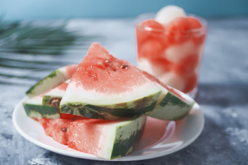 Fresh ripe sliced watermelon on gray background
