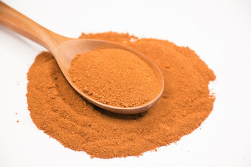 Paprika, ground red peppers on white background.