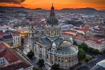 Tafelkleed Budapest, Hungary - Aerial drone view of the beautiful St.Stephen's Basilica (Szent Istvan Bazilika) with a golden sunset. Parliament of Hungary and Fisherman's Bastion (Halaszbastya) at background © zgphotography
