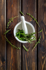 Healing herbs for medicine on wooden background top view