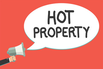 Text sign showing Hot Property. Conceptual photo Something which is sought after or is Heavily Demanded Man holding megaphone loudspeaker speech bubble message speaking loud
