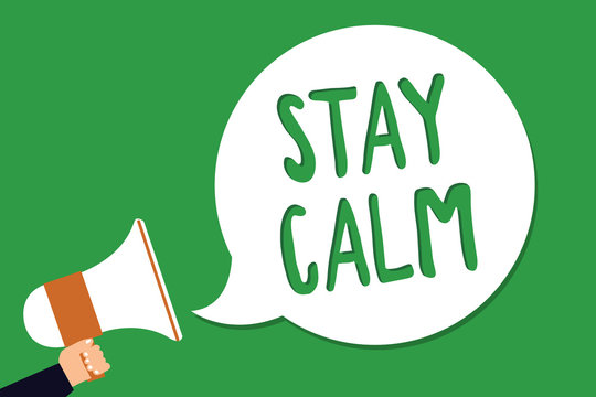 Conceptual hand writing showing Stay Calm. Business photo showcasing Maintain in a state of motion smoothly even under pressure Man holding megaphone loudspeaker screaming green background