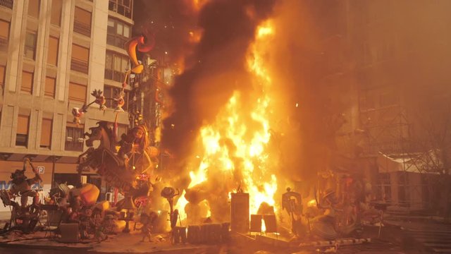 VALENCIA, SPAIN - MARCH 19, 2019: Artistic monument in fire. La Crema taking plane on final night of Fallas, traditional celebration held in commemoration of Saint Joseph