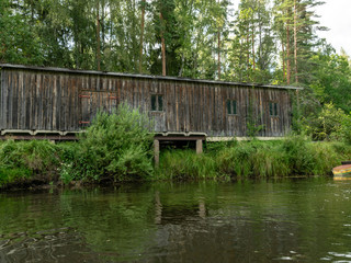 view of an old wooden building that is a boat base