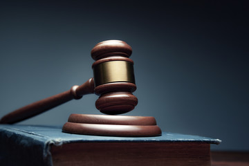 wooden judge on book on the desk