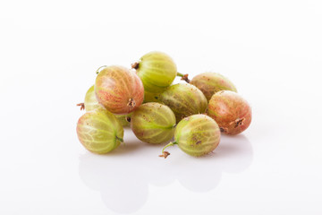 heap of green gooseberries isolated on white background