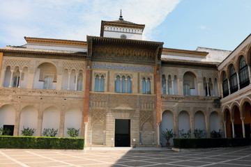 Seville / Spain – September 15 2018: An ornate entrance inside the Alcazar palace in Seville