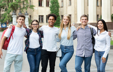 Group of students standing in front of university