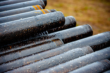 Oil Drill pipe. Rusty drill pipes were drilled in the well section. Downhole drilling rig. Laying...