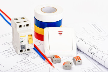Fototapeta premium Automatic circuit breakers, copper single core cable. Accessories for safe and secure electrical installation. Electrical equipment, protection and control, white background.