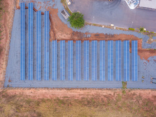 Aerial view of solar panels in factory using clean and renewable energy. Drone shot in the state of Mato Grosso, Brazil. Environment concept, zero carbon emission, clean electricity and future.