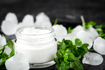 concept cooling organic cosmetics on dark background close up