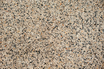 Small stones and sand in concrete. Background for landscape design