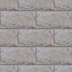 Seamless soft focus texture of decorative concrete wall from bricks.