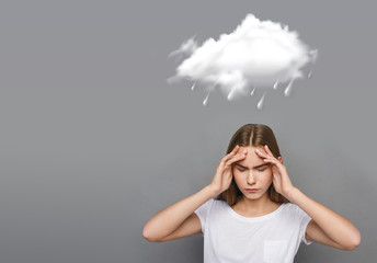 Rainy weather icon and girl with terrible headache on gray