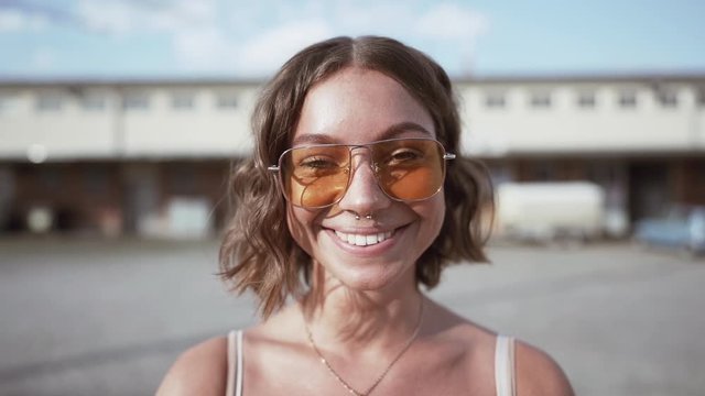 closeup of a young woman. smiling in slowmotion