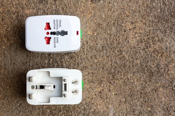 Close up of universal electric socket plug adapters used for travel. Used to connect to different...