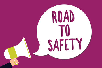 Word writing text Road To Safety. Business concept for Secure travel protect yourself and others Warning Caution Man holding megaphone loudspeaker speech bubble screaming purple background