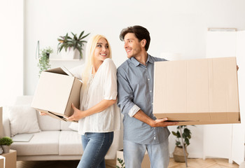 Confused Couple Carrying Moving Boxes Ready For Relocation Or Separation